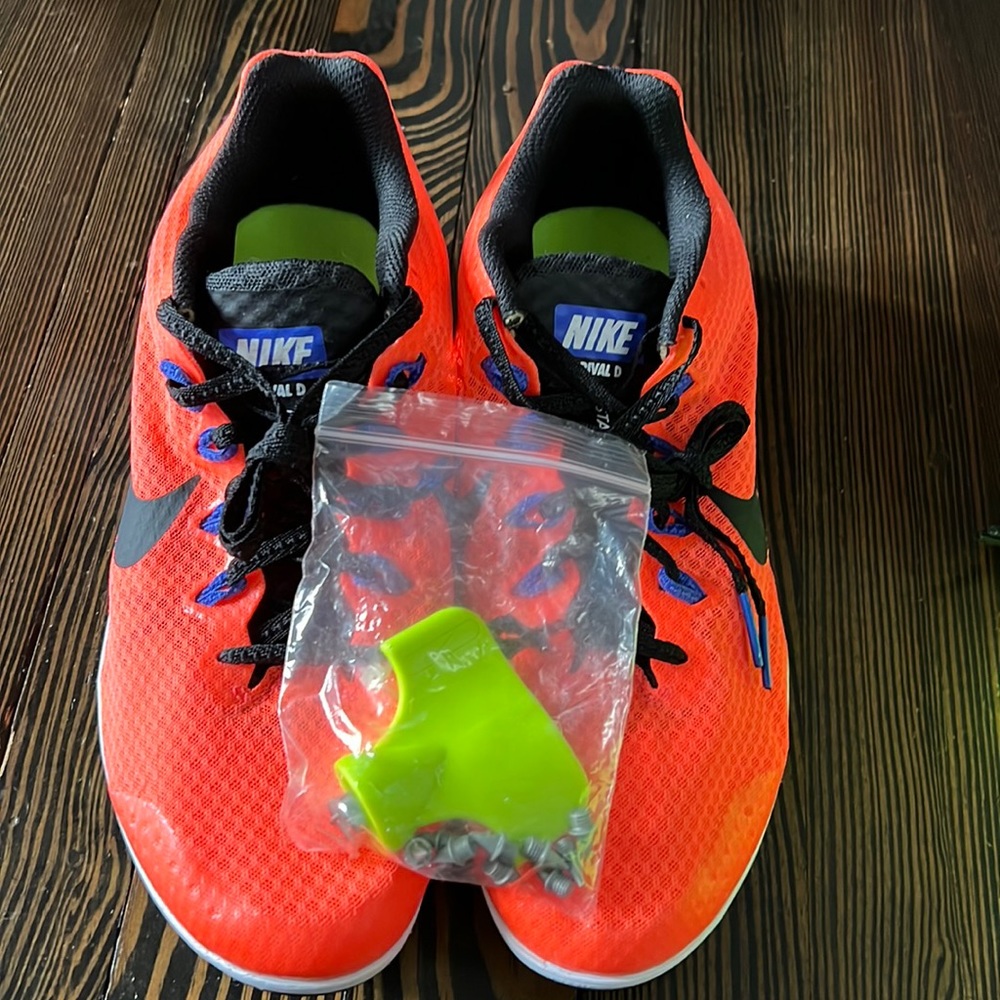 Nike Zoom Rival D track spikes in orange and black.